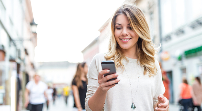 Attractive woman finding shopping deals online