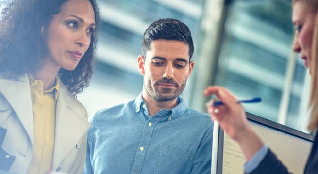 Female and male business partners meeting with bank representative