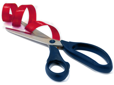 Blue scissors cutting ribbon