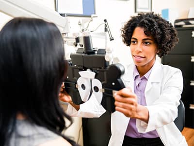 Female optometrist with patient.