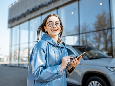 Woman on Phone standing near car